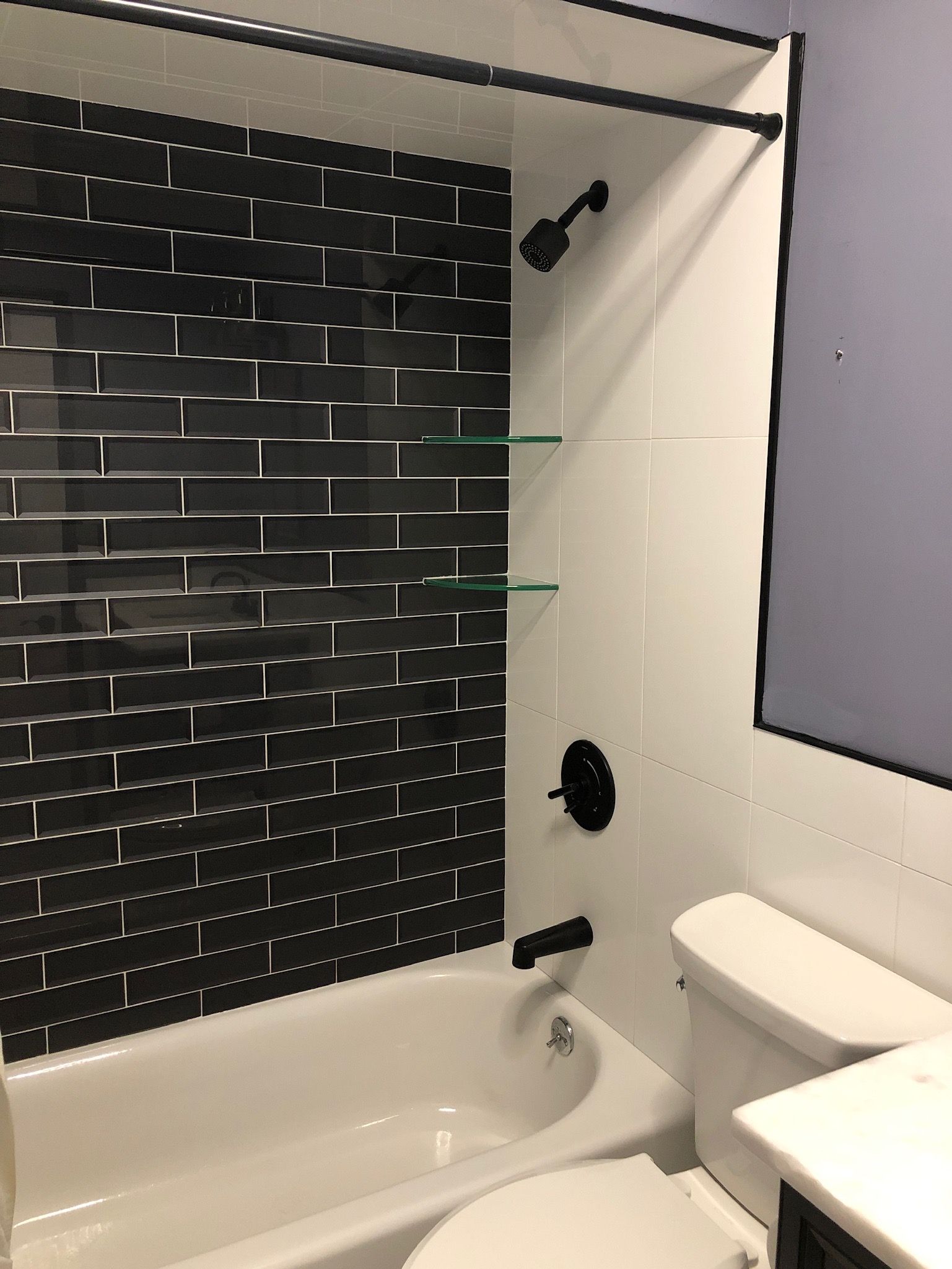 A bathroom with a bathtub toilet and shower