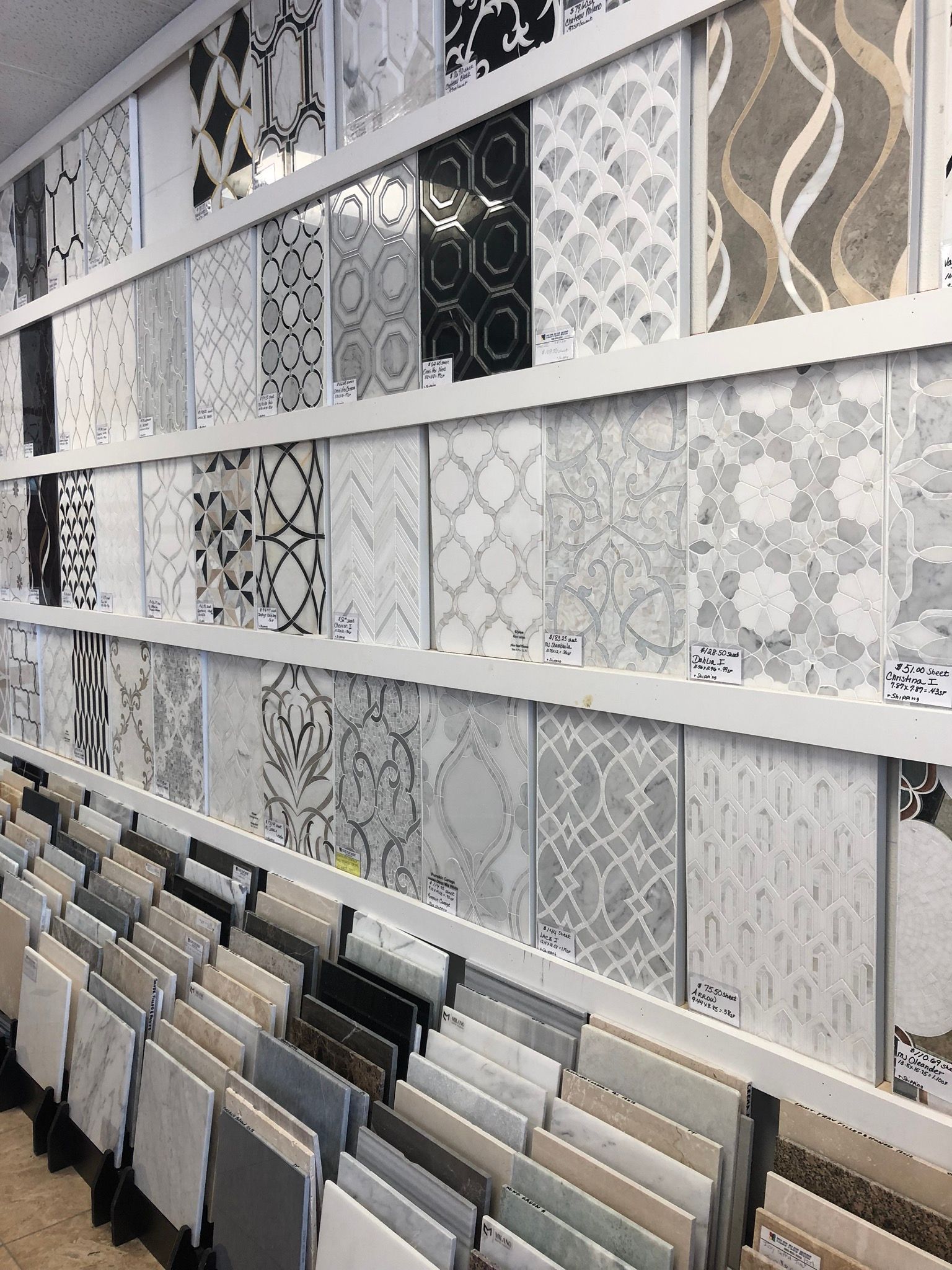 There are many different types of tiles on display in this store.