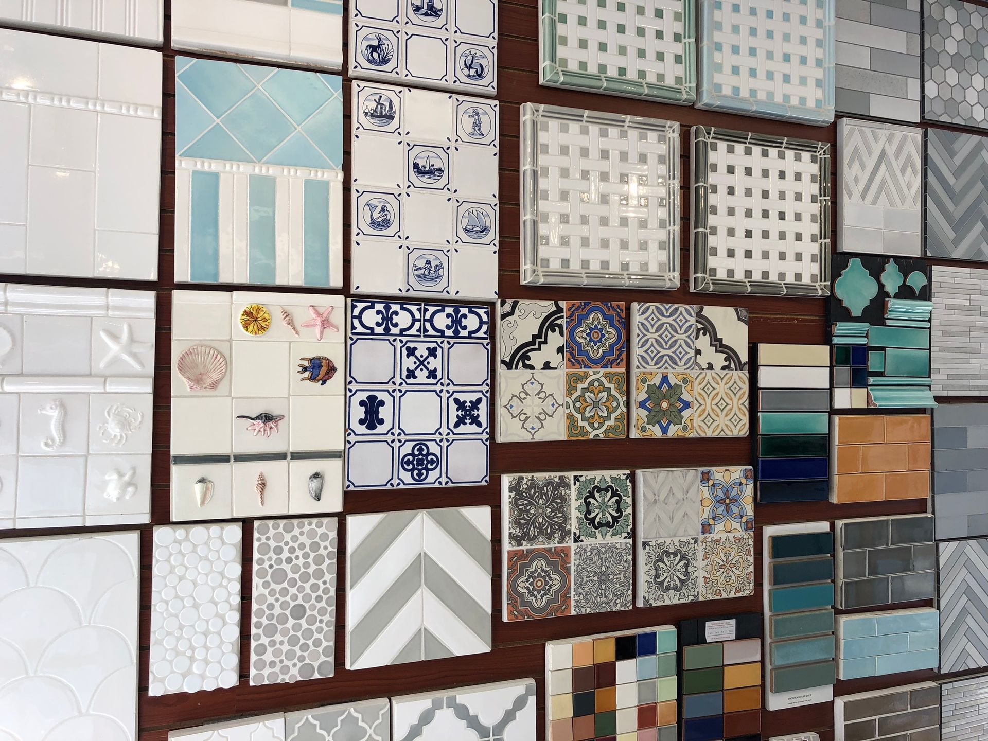 A wall with a lot of different tiles on it