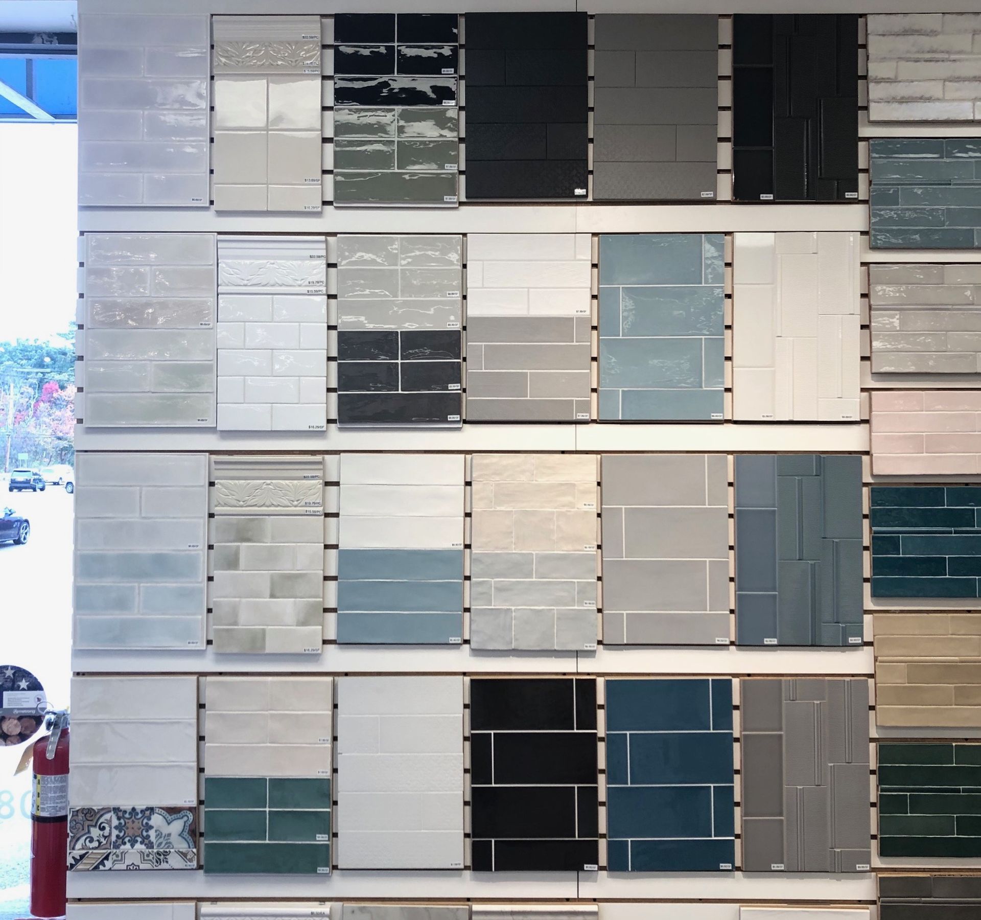 A wall full of tiles of different colors and sizes