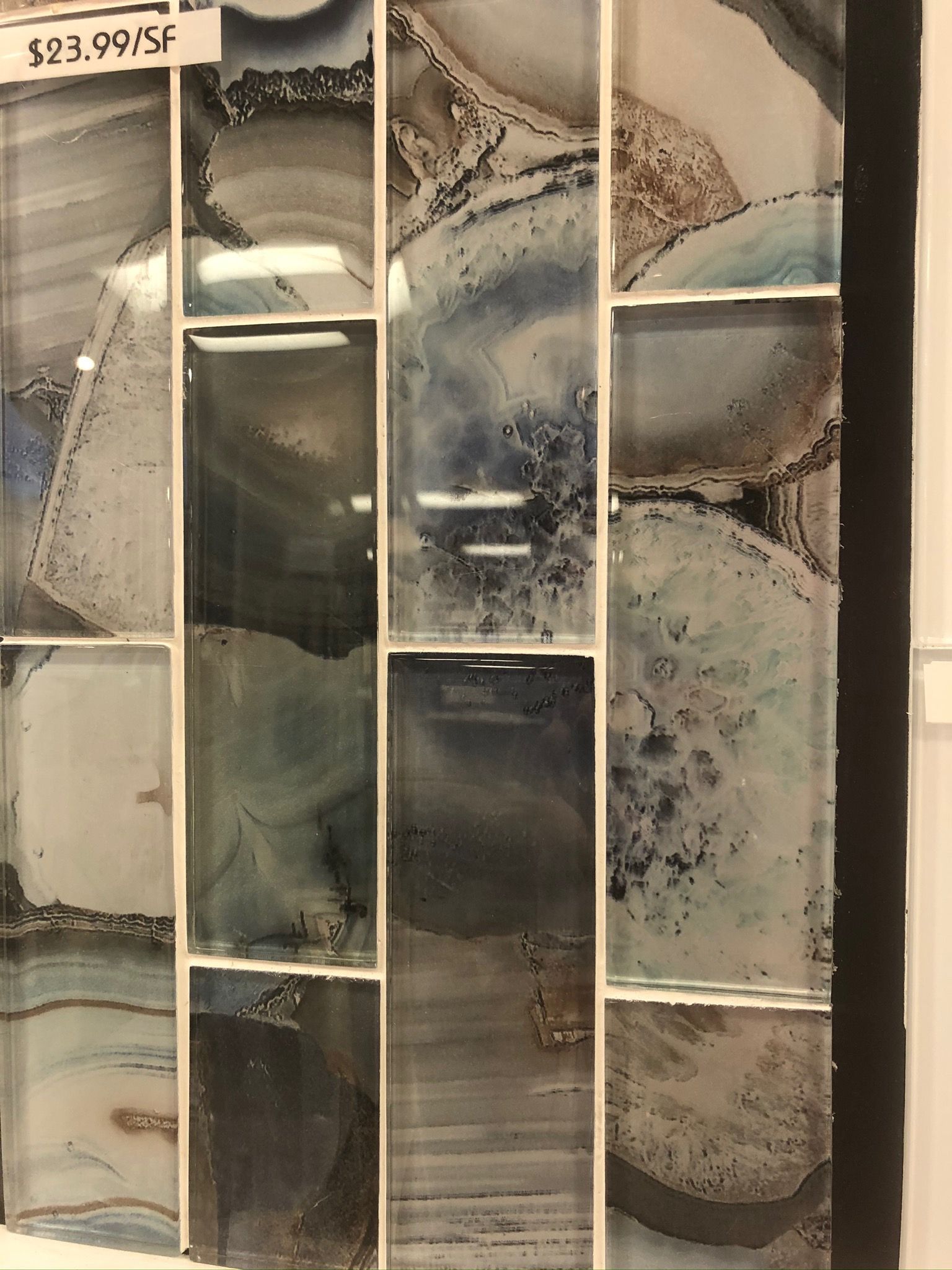 A picture of a wall with a sign that says $ 23.99 / sf on it.