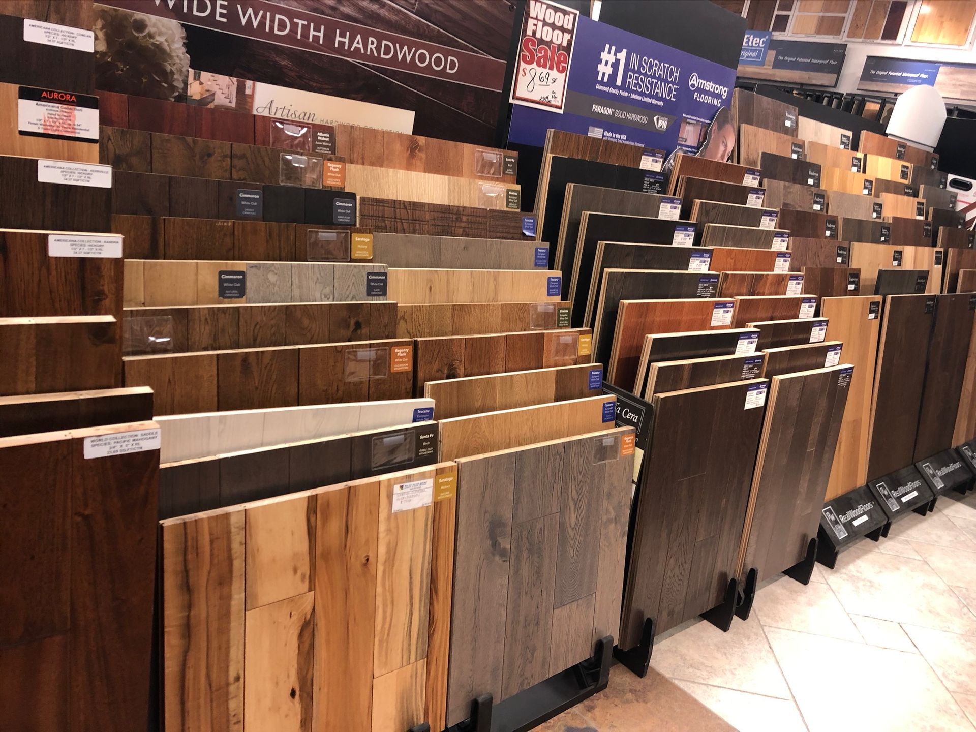 A large display of hardwood flooring in a store.