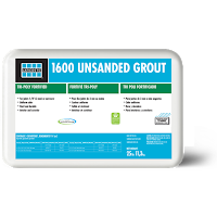 A bag of 1600 unsandy grout is sitting on a white surface.