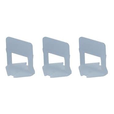 A set of three plastic tile spacers on a white background.