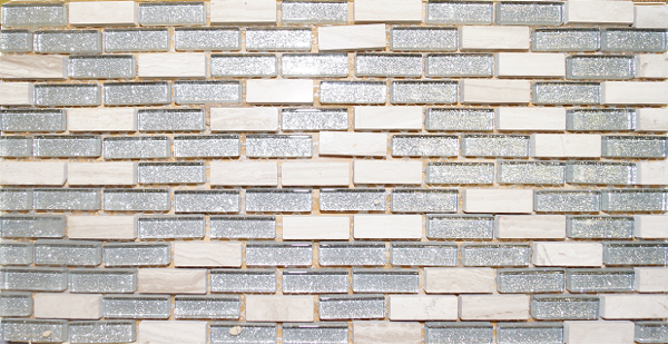 A close up of a brick wall with gray and white tiles