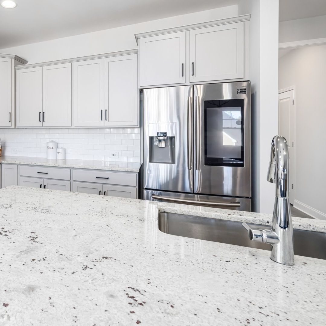 A kitchen with stainless steel appliances and granite counter tops