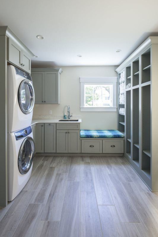 A laundry room with a washer and dryer stacked on top of each other.