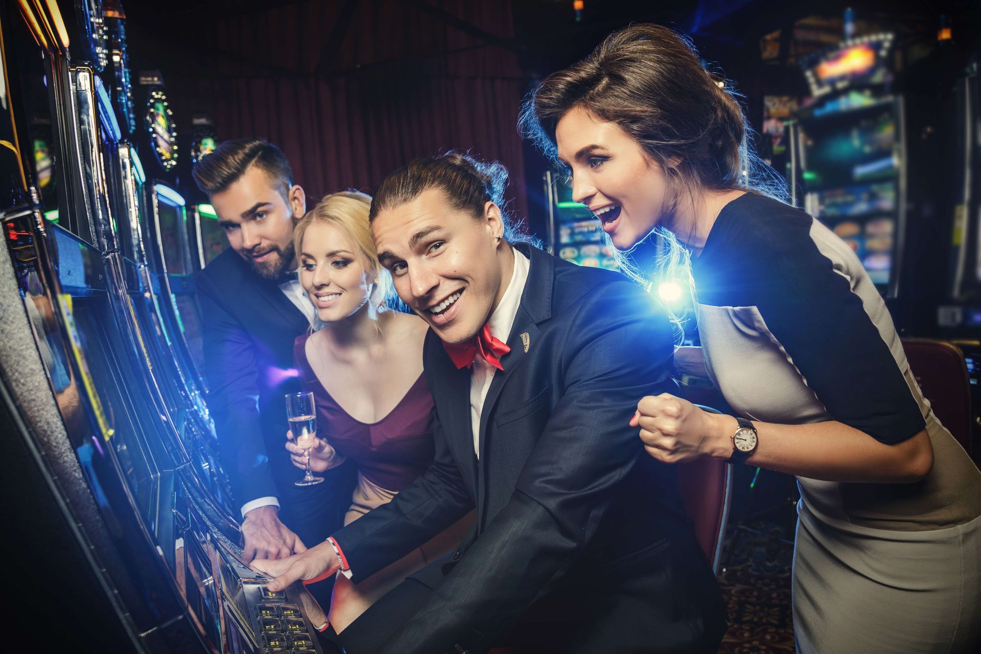 a group of people are playing a slot machine in a casino