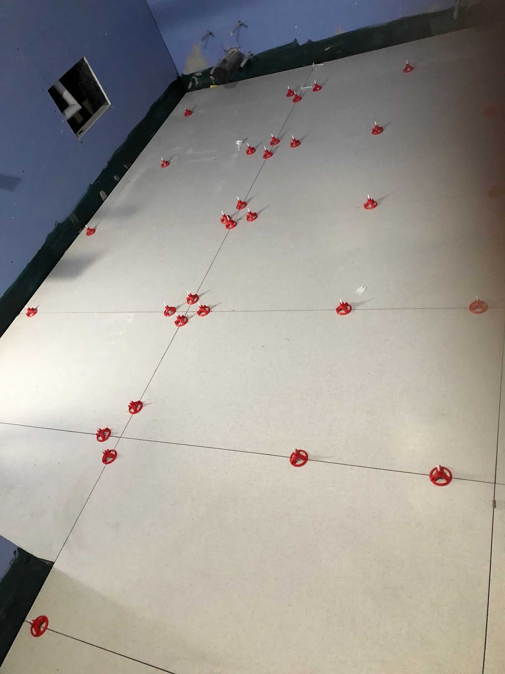 A large white floor with red dots on it