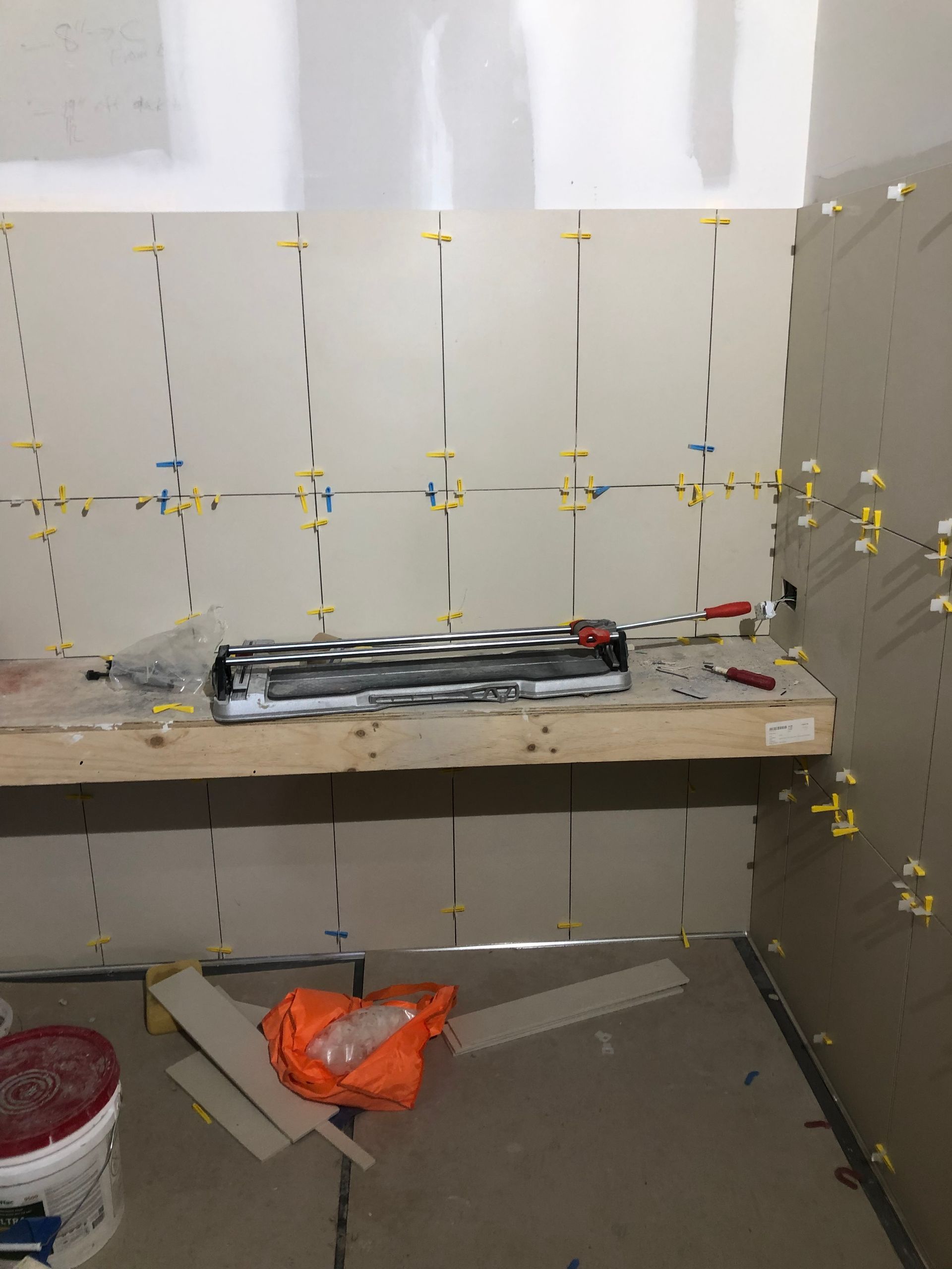 A room that is being remodeled with tools on the floor