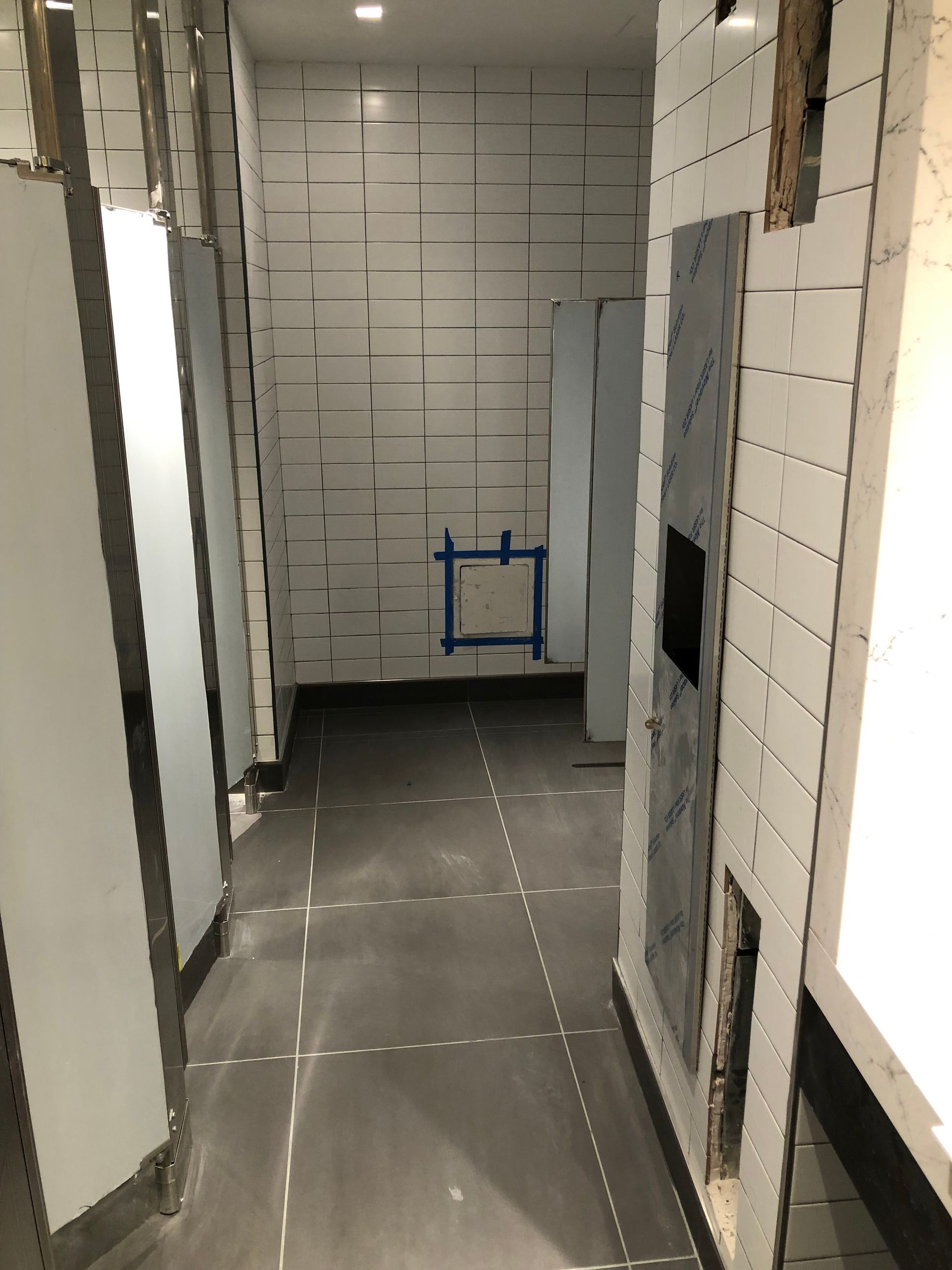 A hallway in a building that is being remodeled