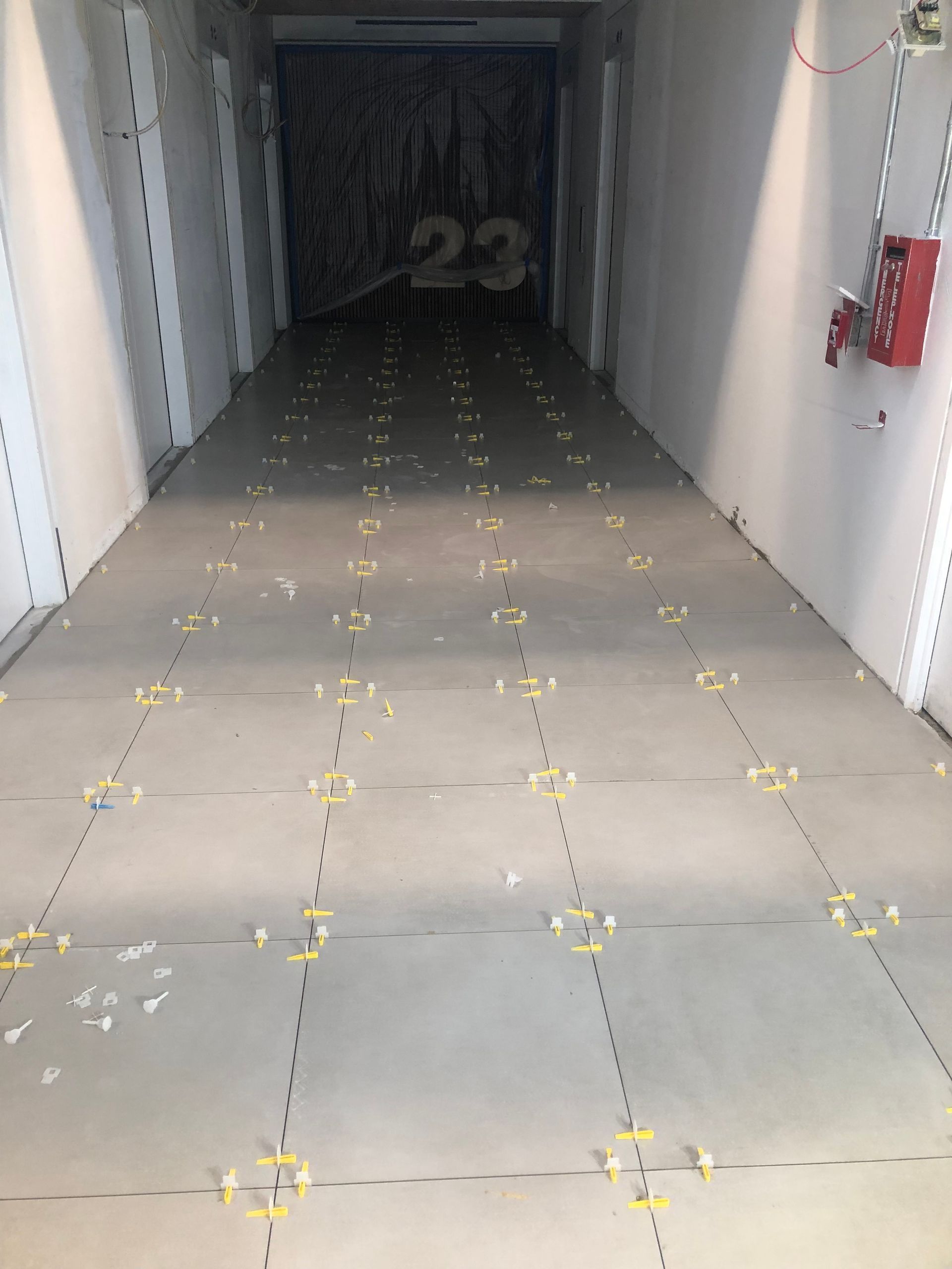 A long hallway with the number 23 on the wall