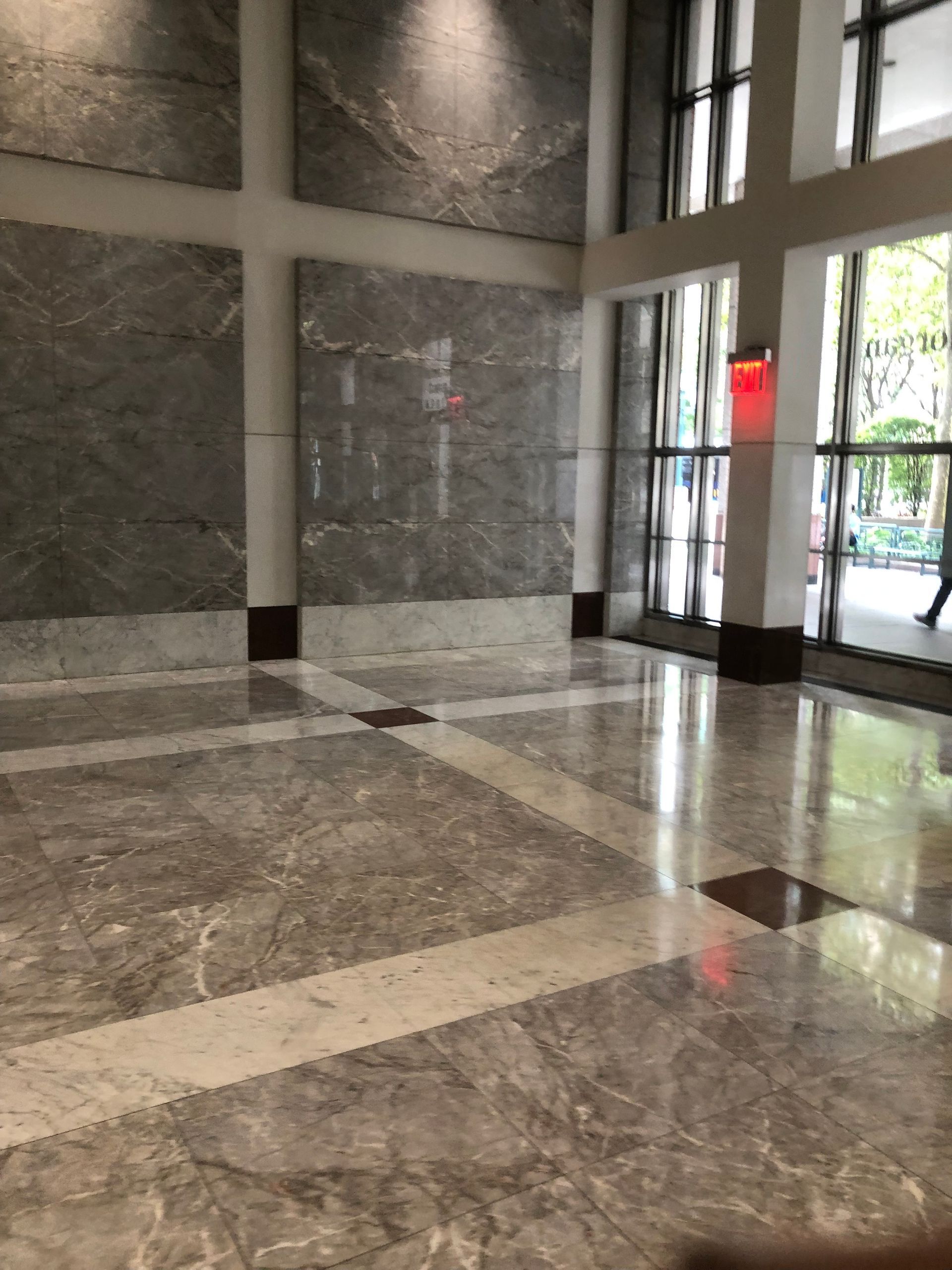 A large room with marble floors and walls