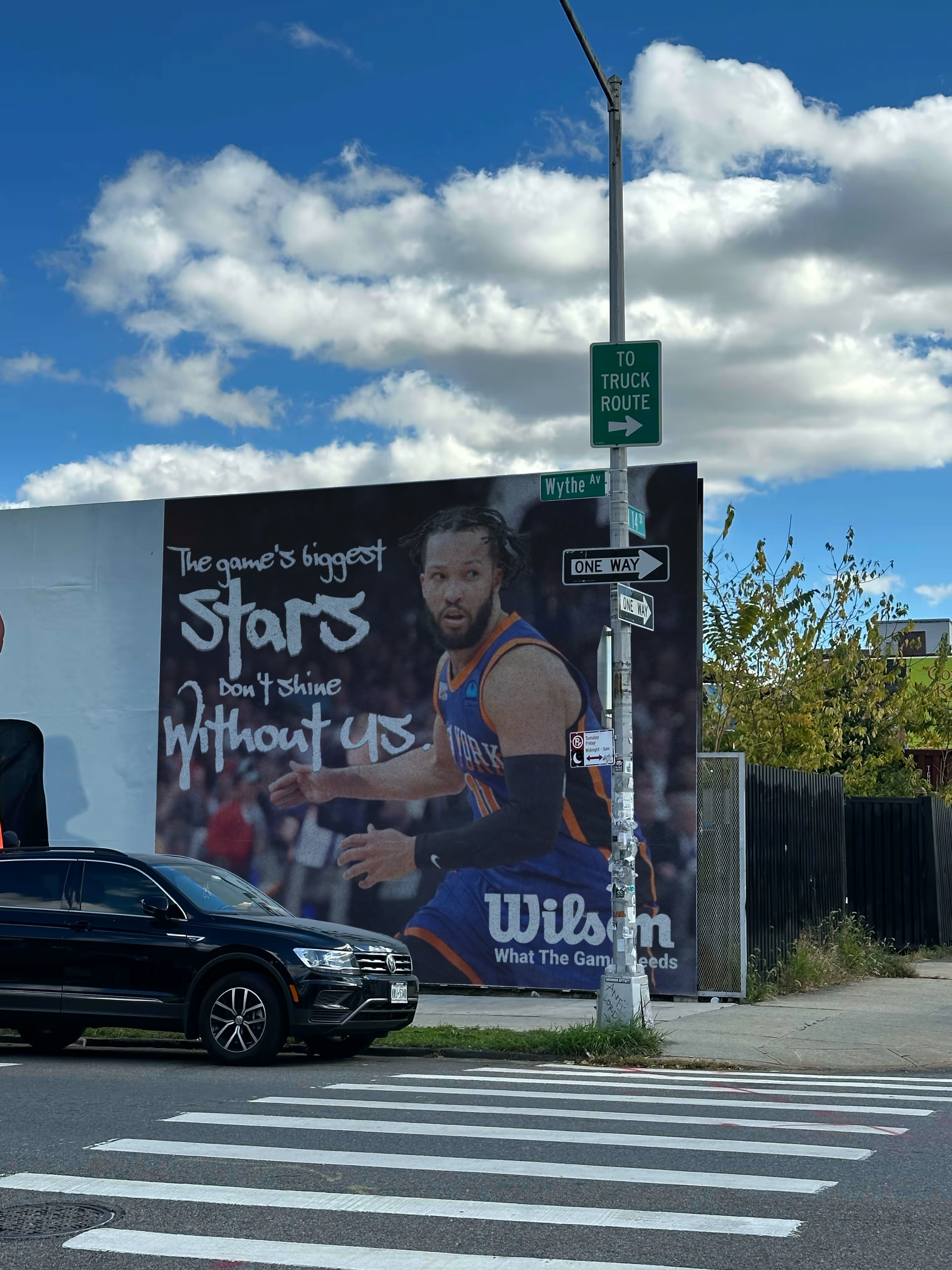 Billboard with basketball player Jalen Brunson on a Wilson ad campaign concept in Brooklyn.