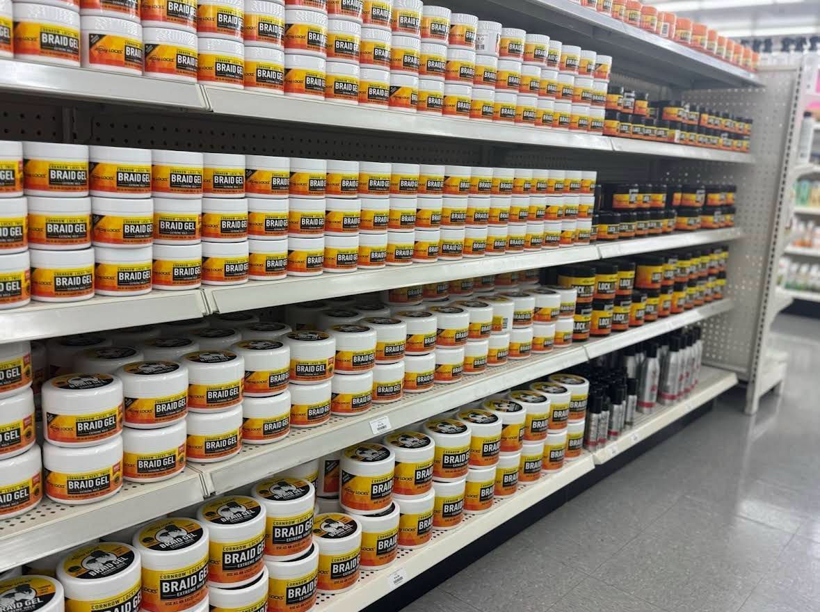 Shelves stocked with numerous jars of products in a store.