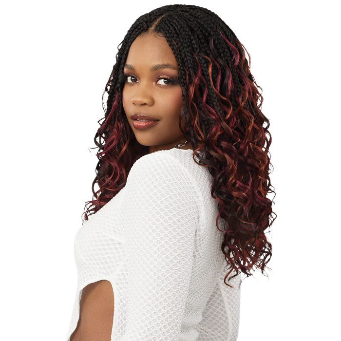 Woman with braided black and burgundy hair, wearing a white textured sweater, looking over her shoulder.