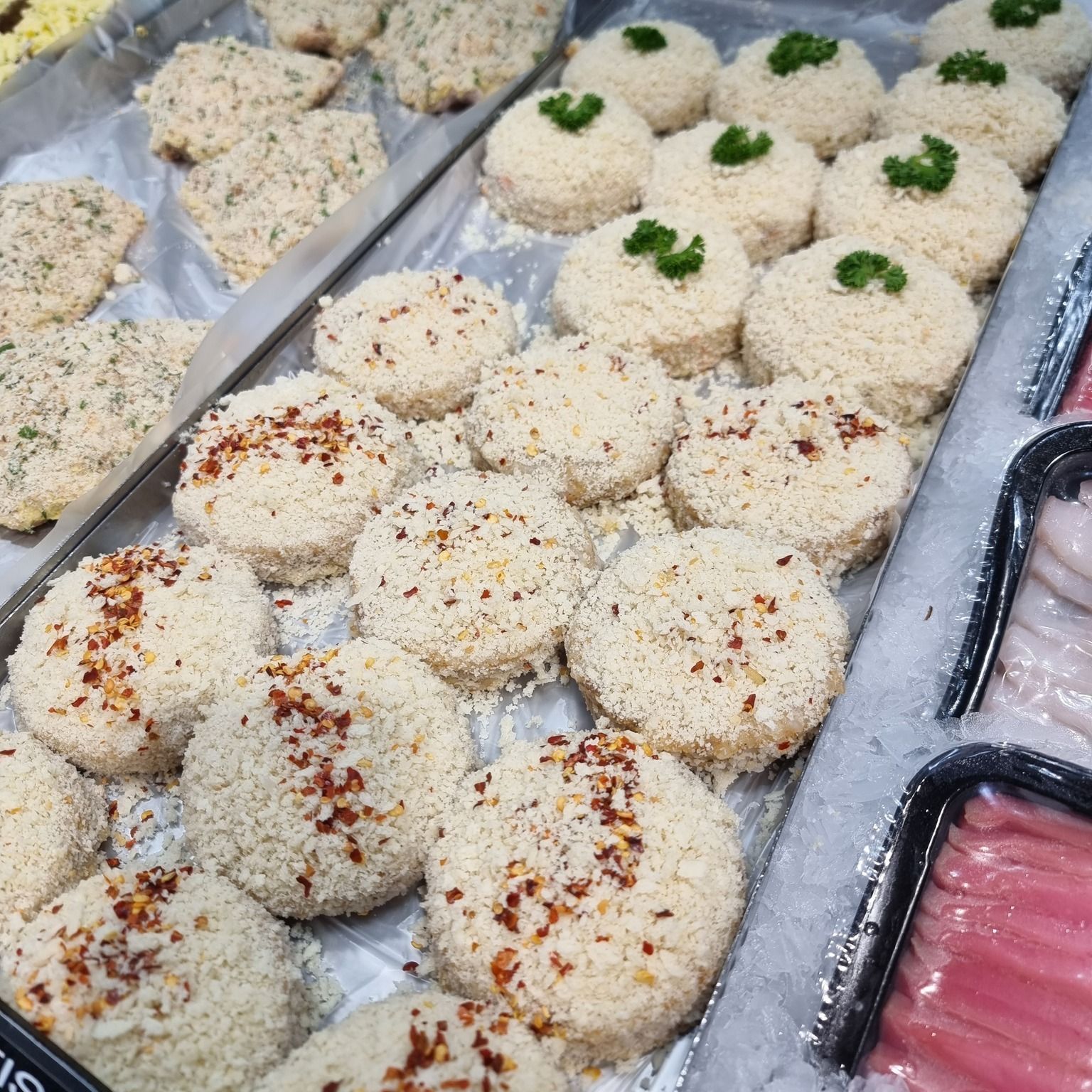Tray of Breaded Food Items, Possibly Patties — Pt Cartwright Seafoods in Warana, QLD