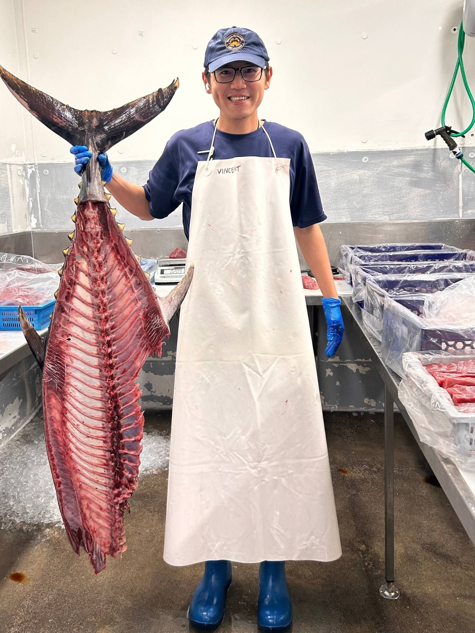 Person Holding a Large, Filleted Fish With a Tail — Pt Cartwright Seafoods in Warana, QLD