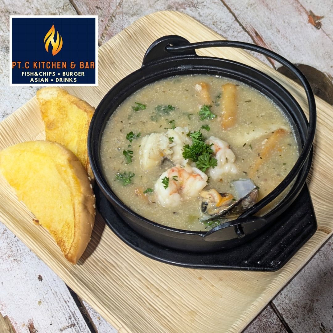 Seafood Soup in a Black Pot, Served With Toasted Bread — Pt Cartwright Seafoods in Warana, QLD