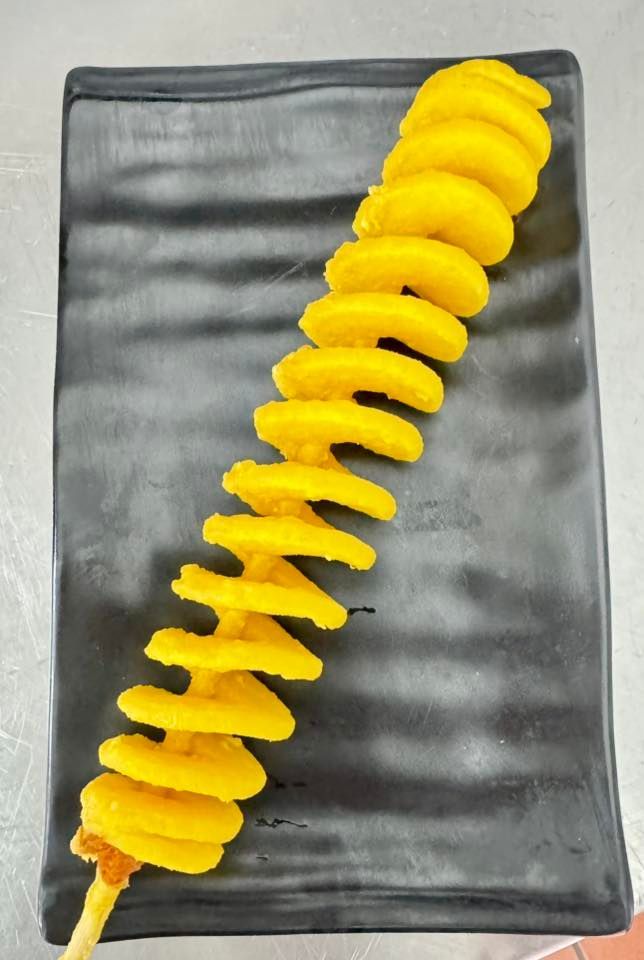Spiral-cut Fried Potato on a Skewer, Yellow and Crispy — Pt Cartwright Seafoods in Warana, QLD