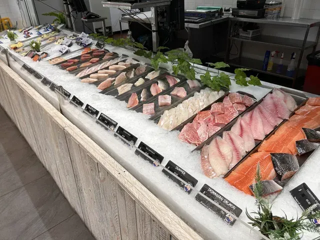 Display of Various Fresh Fish Fillets on Ice in a Refrigerated Case — Pt Cartwright Seafoods in Warana, QLD