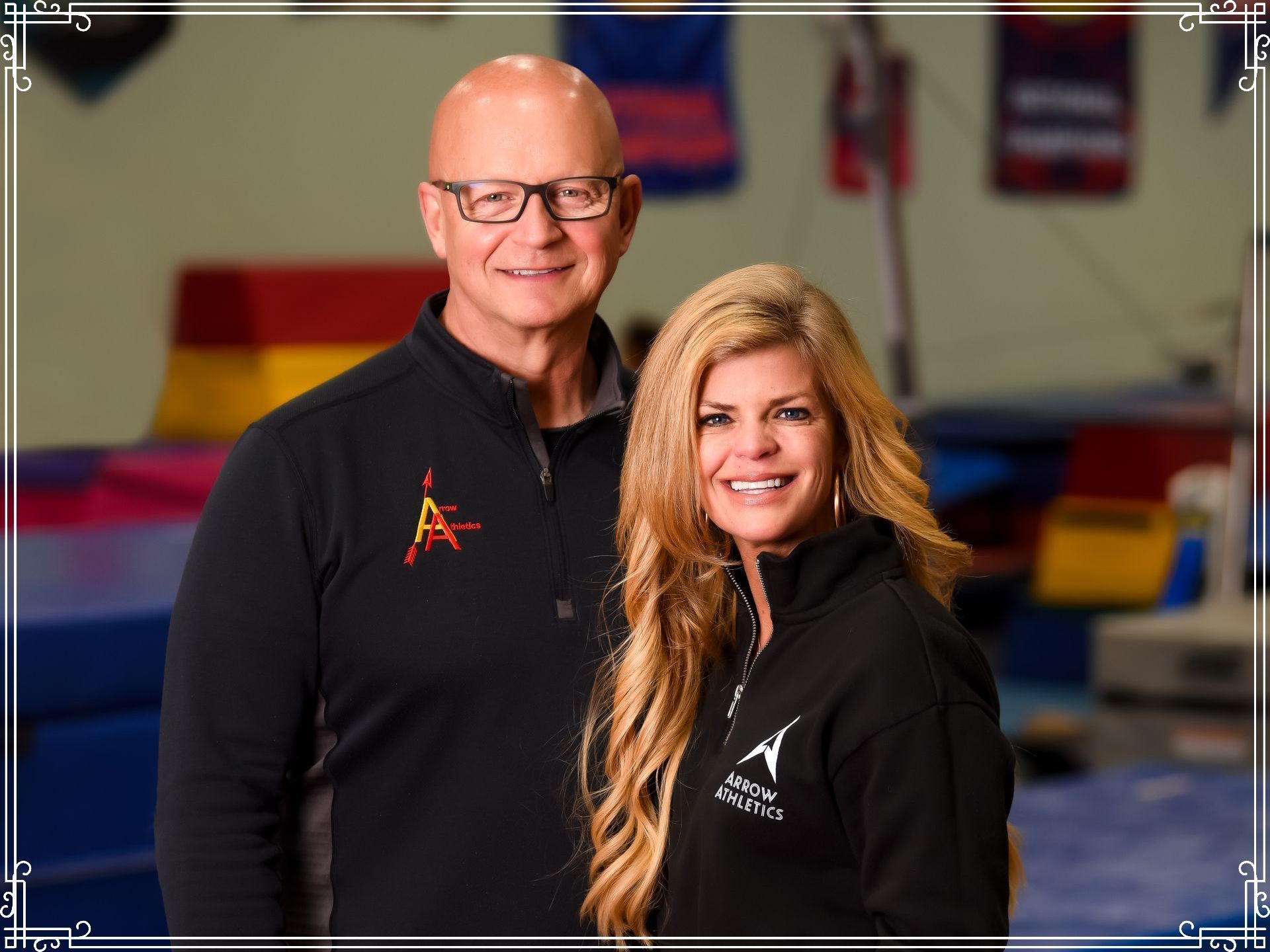 A man and a woman are posing for a picture in a gym.