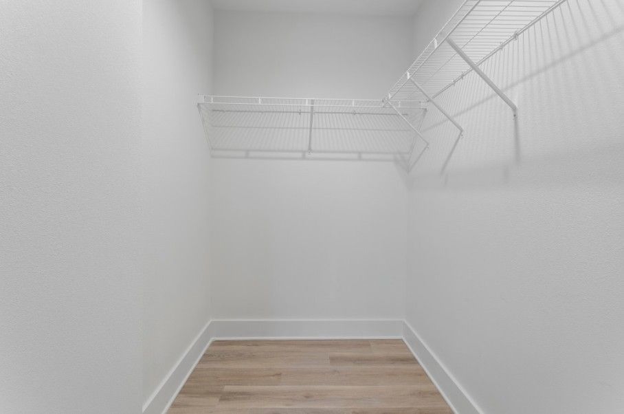 walk-in closet in primary bedroom