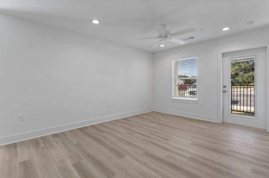 apartment living room in Biloxi with wood flooring and natural light