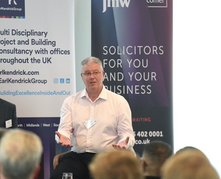 Man giving a talk at a conference.