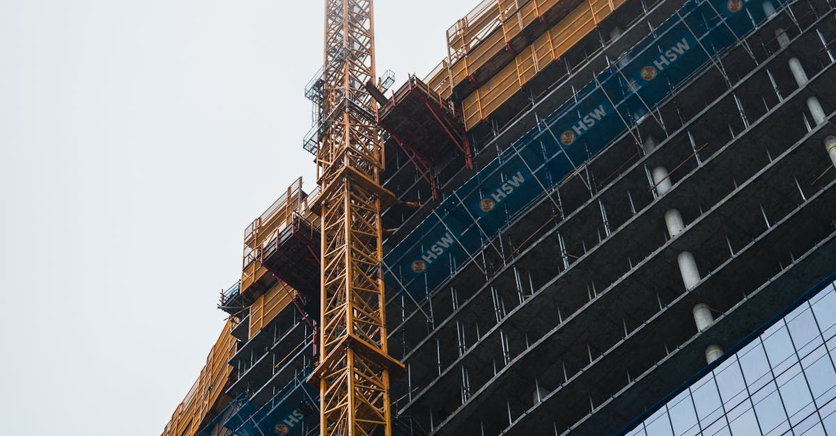 A large building is being built with a crane.