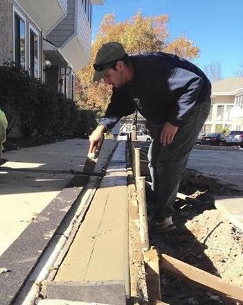 Concrete Installation — Construction Worker Adding Concrete to Surface in Exton, PA