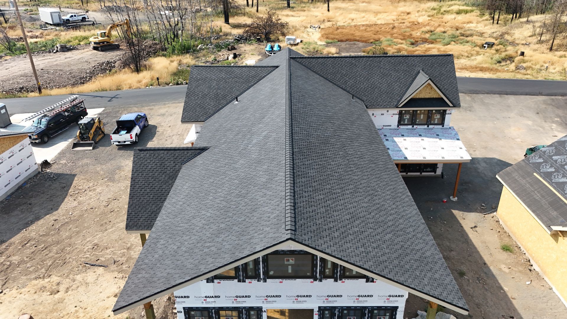 Hand tools: hammer, pliers, screwdriver, wrench, tape measure, and screw anchors on a textured surface.