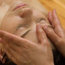 face massage with hand fingers on forehead