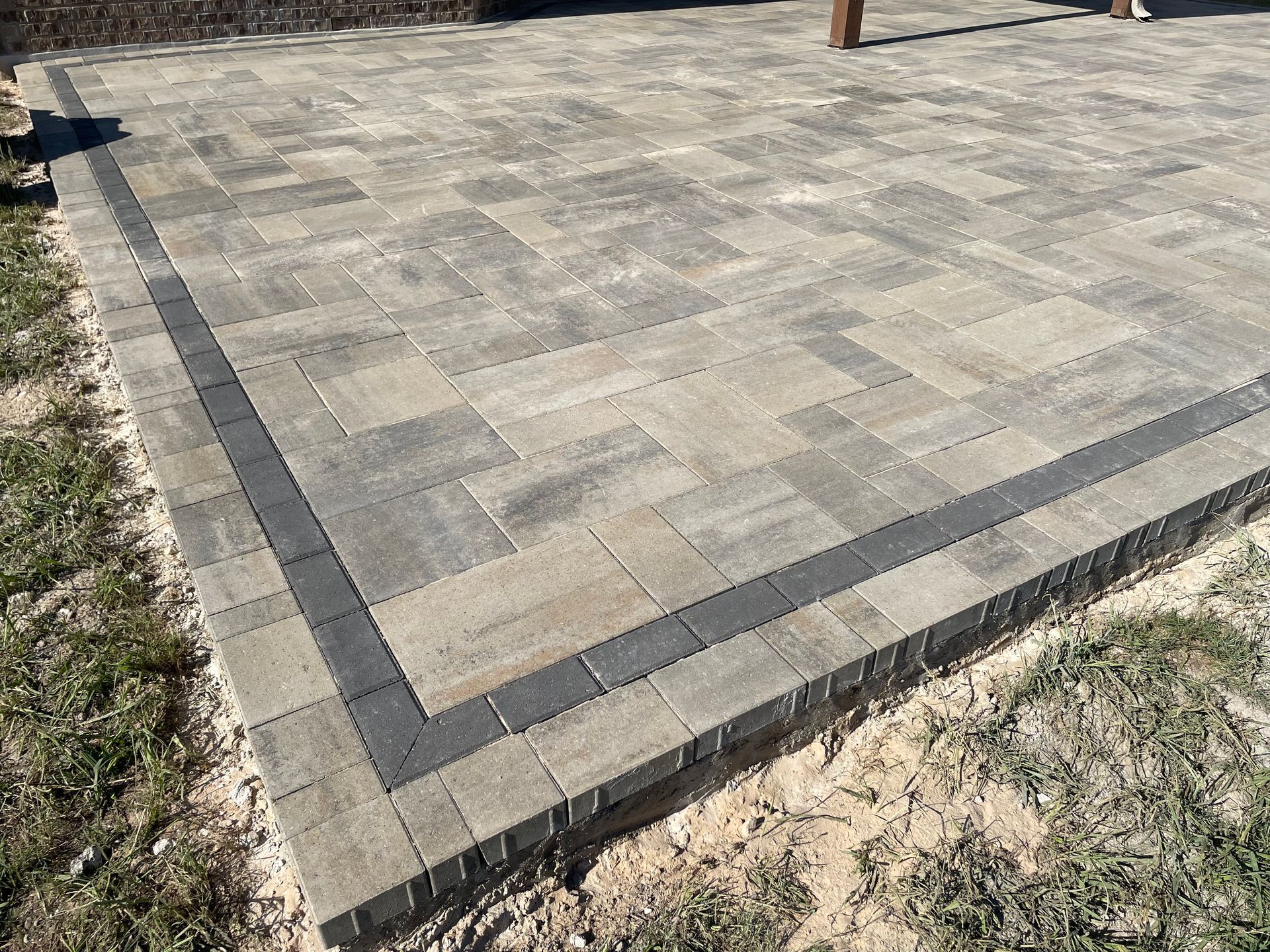 A stone paver patio featuring a light gray.
