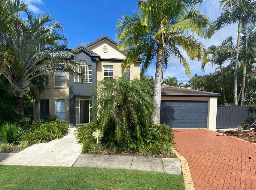 A Large House With Palm Trees in Front of It — TMM Painting in Coolangatta, QLD