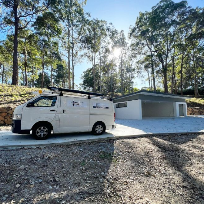 A White Van is Parked in Front of a House in the Woods — TMM Painting in Kingscliff, NSW