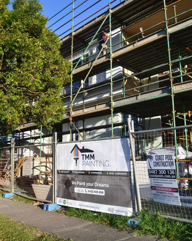 A Building Under Construction With Scaffolding and a Sign That Says TMM Painting — TMM Painting in Coolangatta, QLD