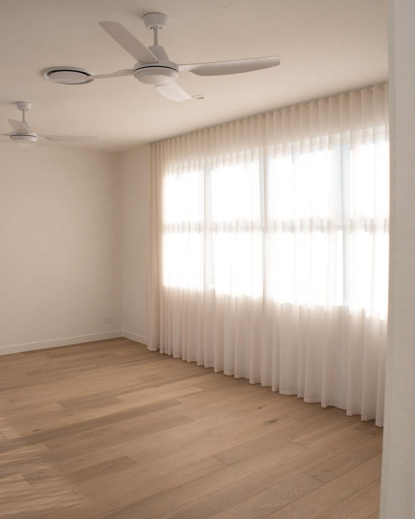 There Are Two Ceiling Fans in the Room and a Lot of Windows — TMM Painting in Carrara, QLD