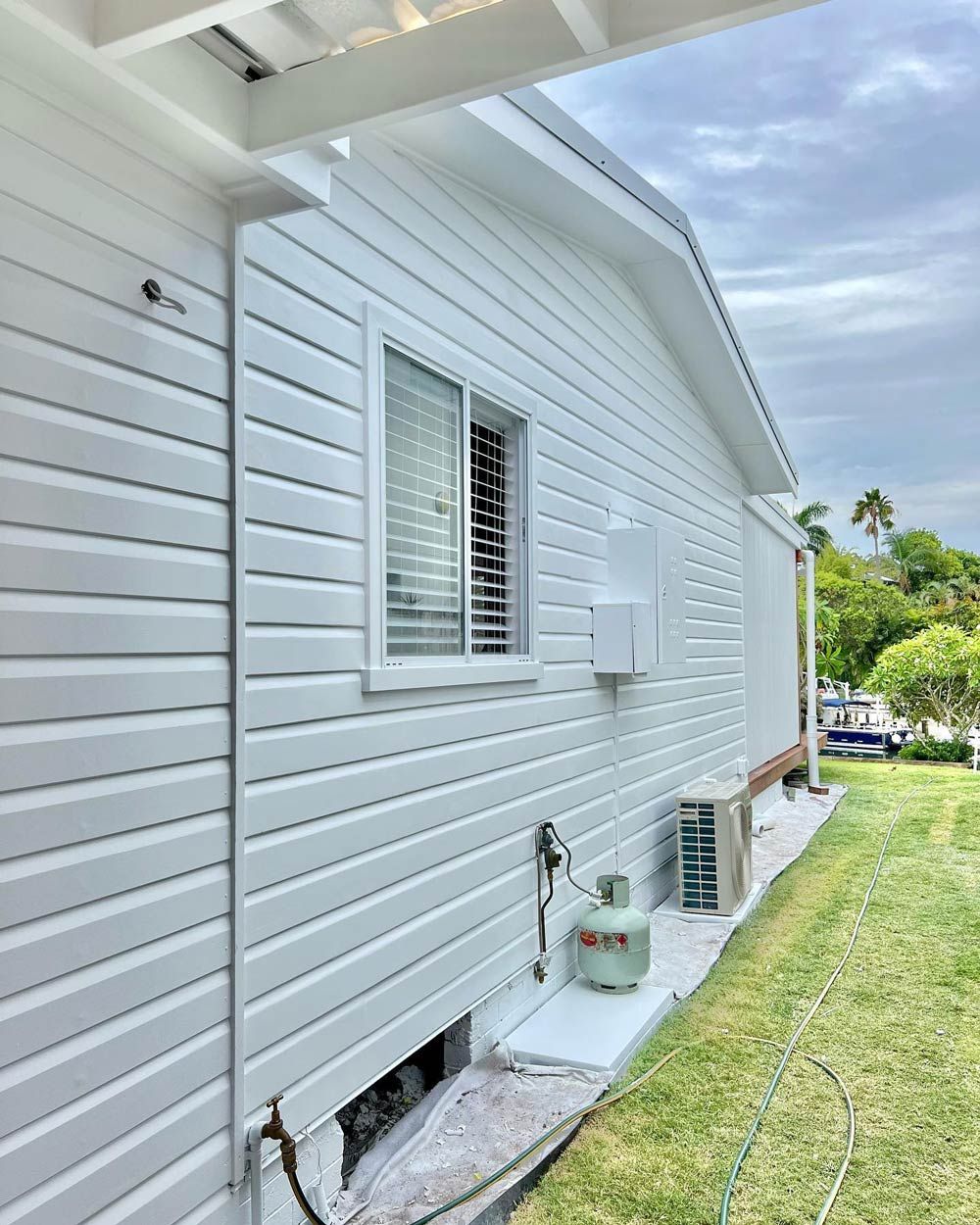 A Newly Painted House With White Siding