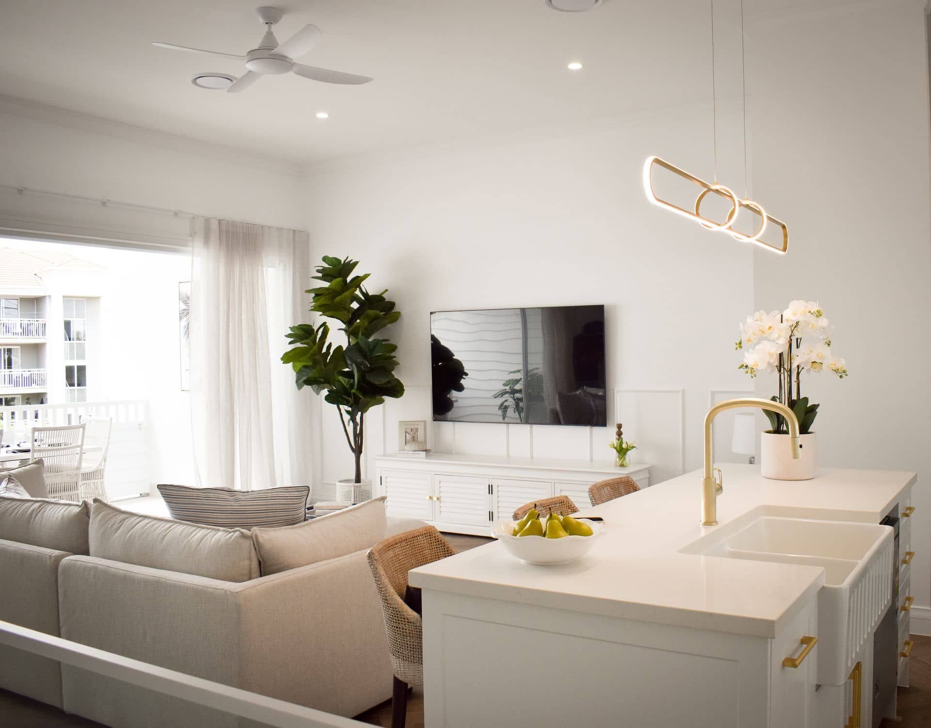 A Man is Pouring Paint Into a Bucket That Says Dulux — TMM Painting in Coolangatta, QLD