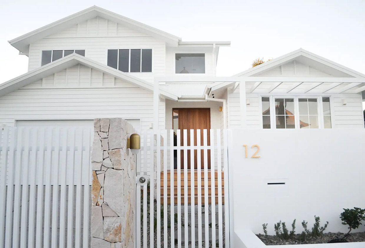 A White House With a White Fence and a Wooden Door — TMM Painting in Coolangatta, QLD