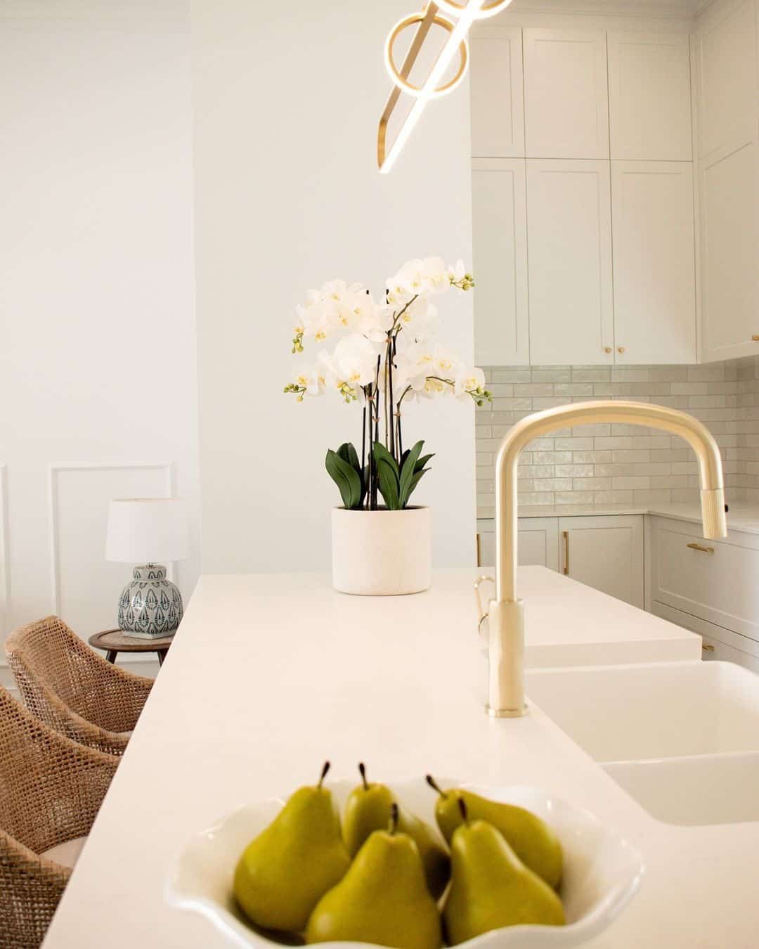 A Bowl Of Pears Sits On A Kitchen Counter Next To A Sink  — TMM Painting in Coolangatta, QLD