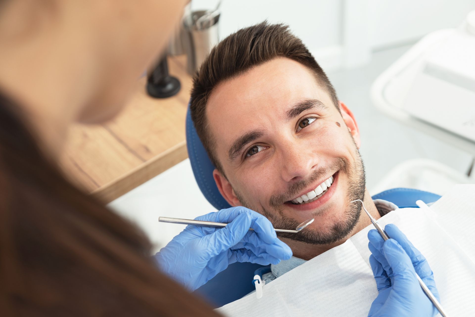 A smiling man in a dentist chair at Brookside Dental Associates, Redlands, CA