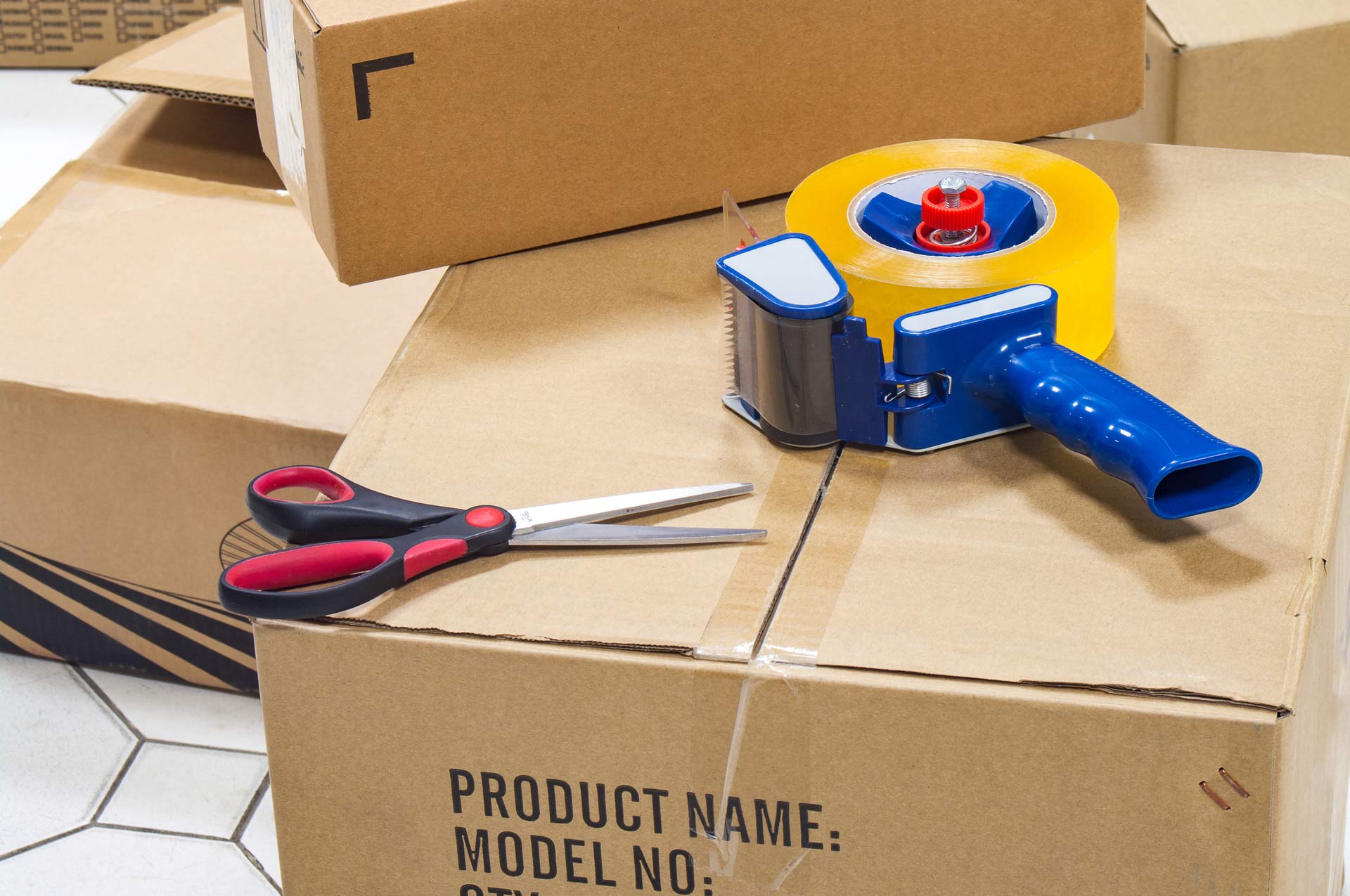 Packing Tape Dispenser, Scissors on the Cardboard Box | Molendinar, Qld | Ashtons Removals
