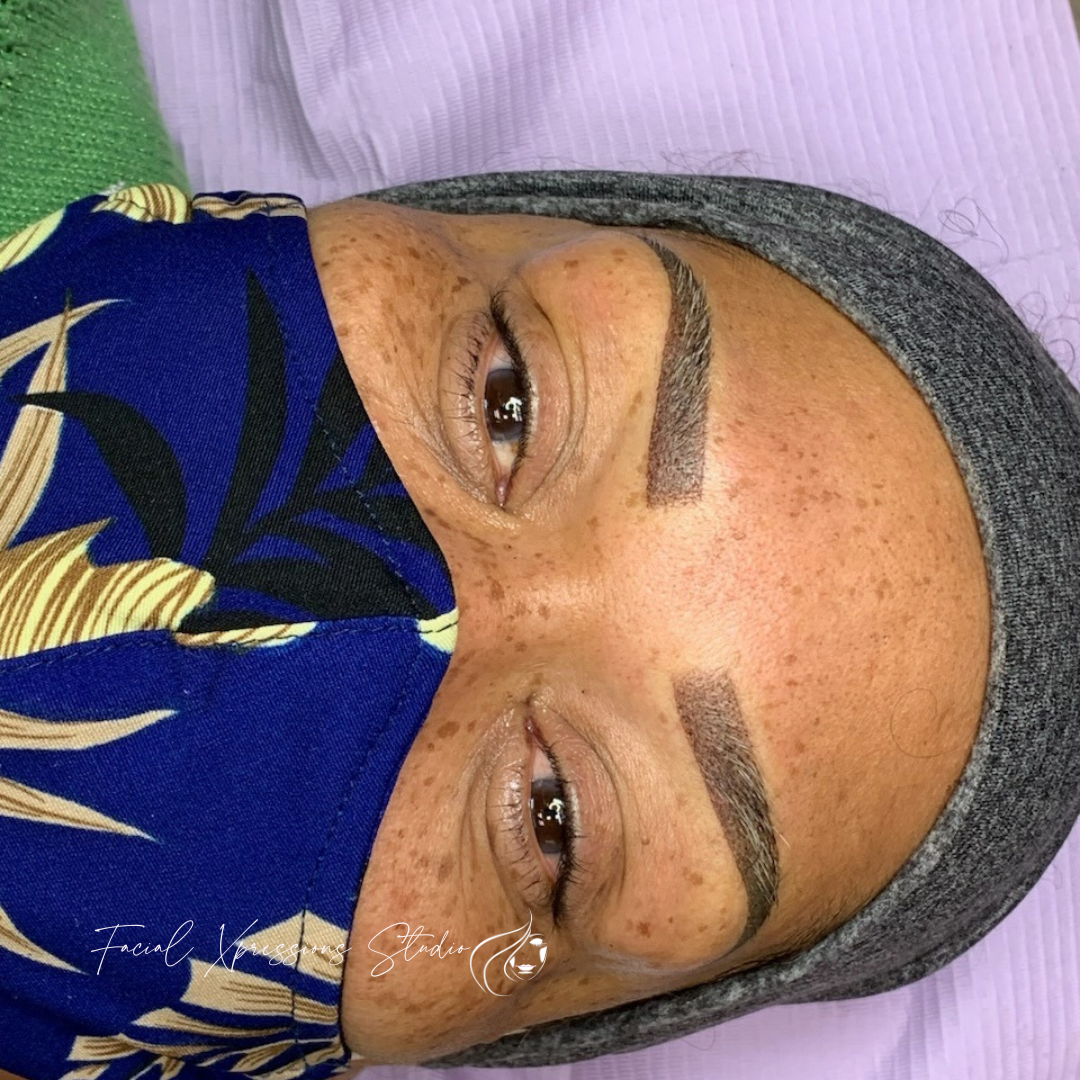 A woman is wearing a blue mask on her face.