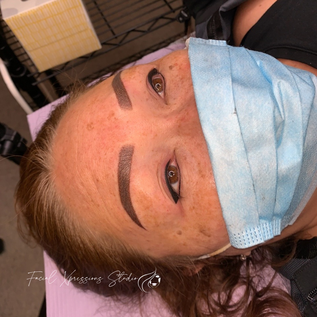 A close up of a woman wearing a face mask