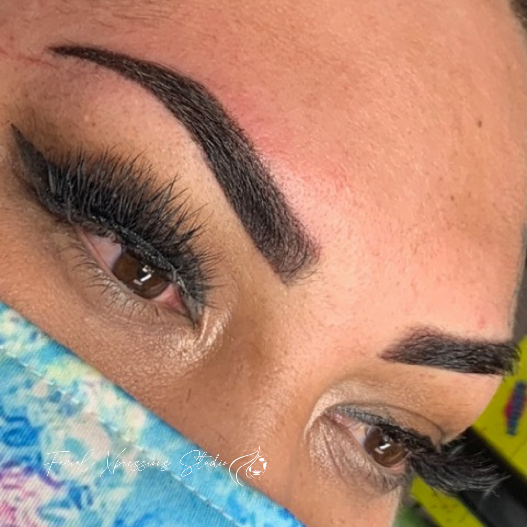 A close up of a woman 's face with long eyelashes and a mask on.