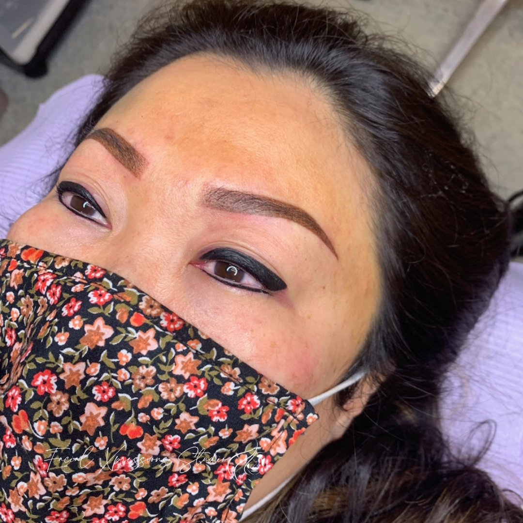 A woman wearing a face mask with flowers on it