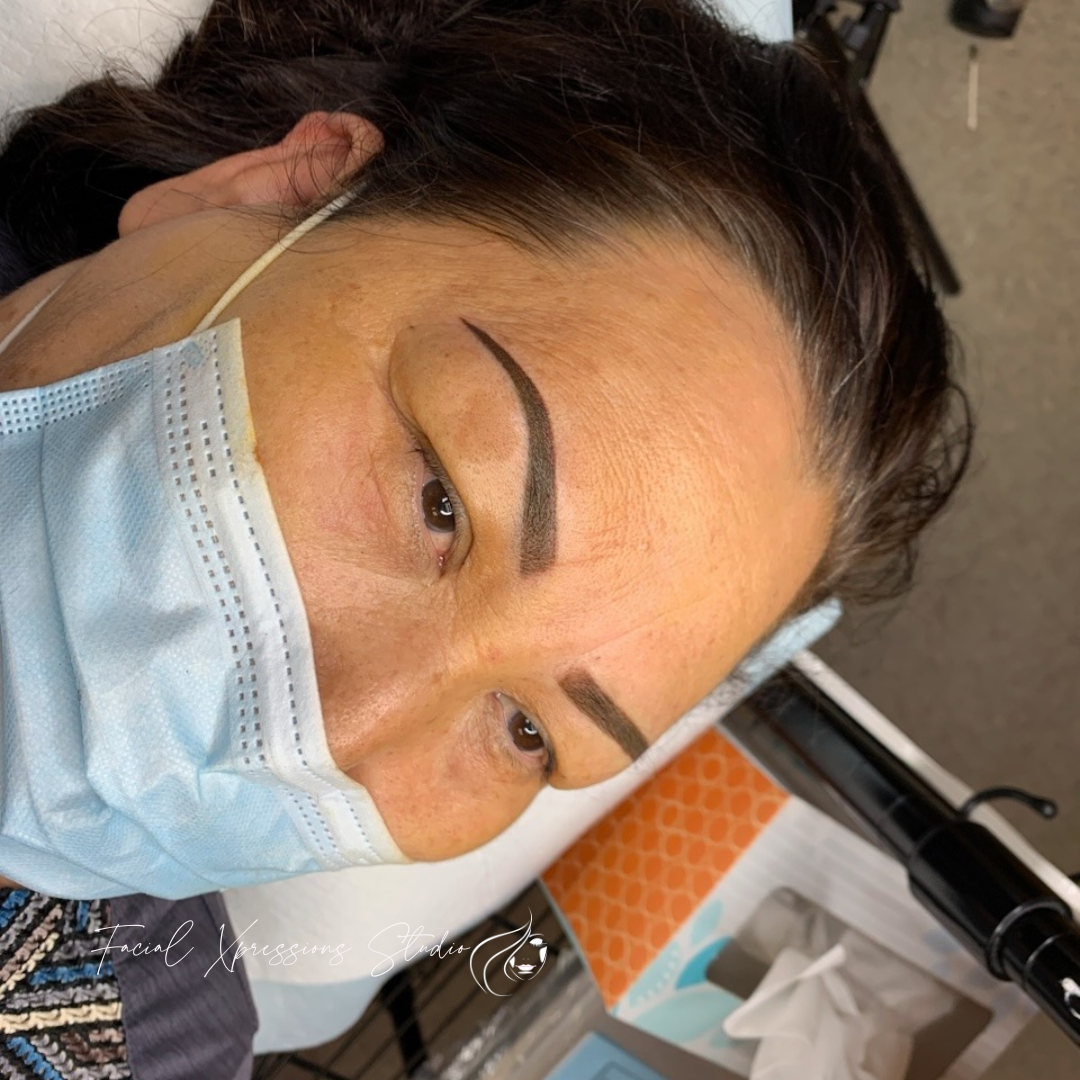 A close up of a woman wearing a face mask