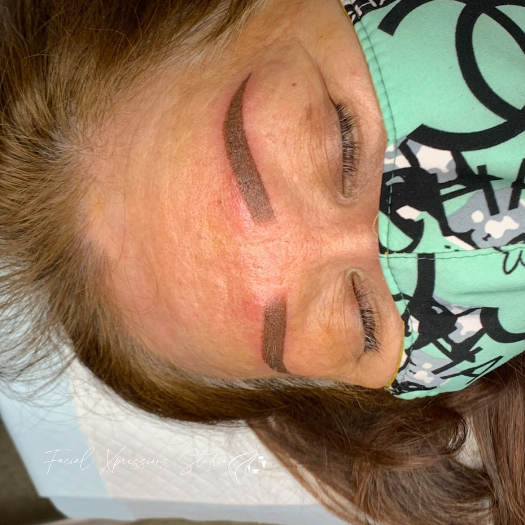 A woman is wearing a mask on her face.